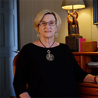 Faye Slater sitting in office
