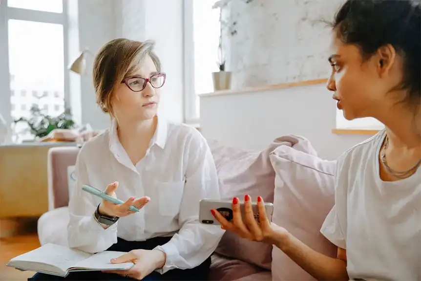 Two people in therapy, palms up, running out of things to say. 